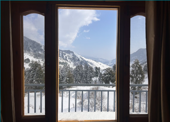 Snowy mountain view from balcony