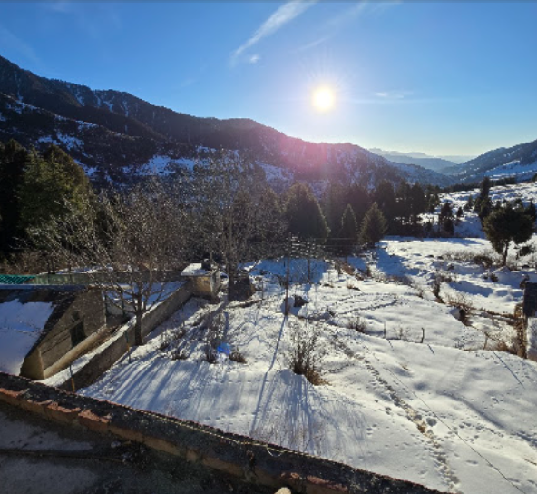 Snowy mountain surroundings at golden hour